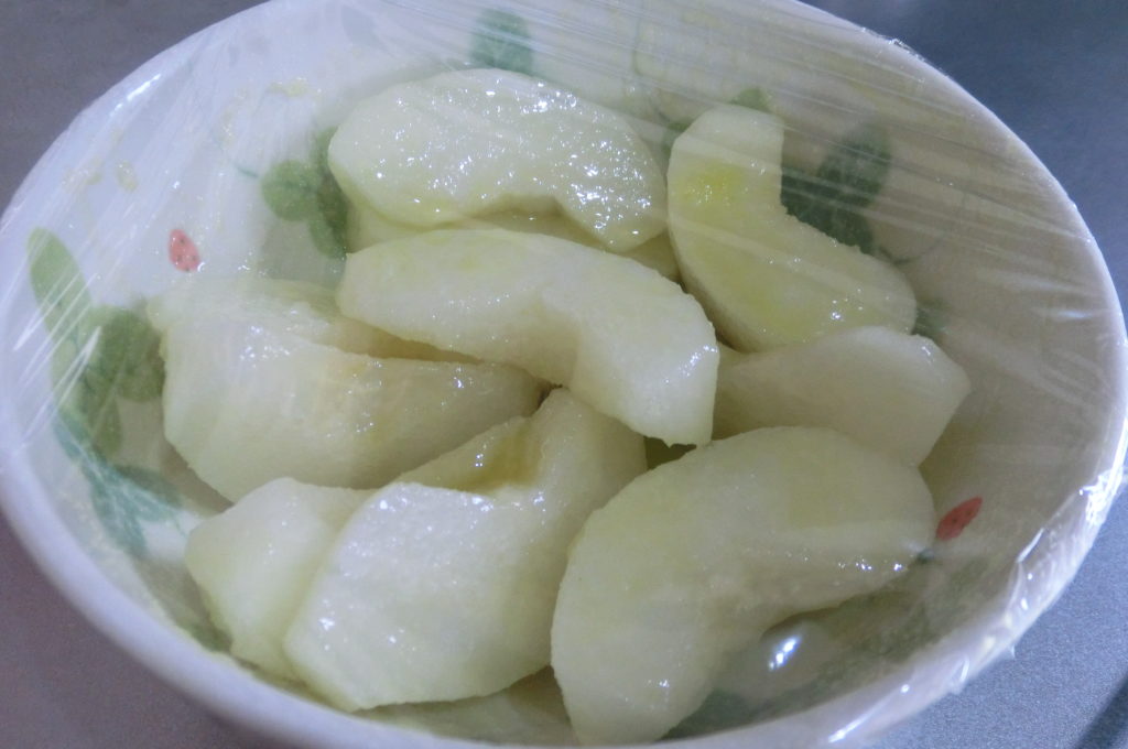 Cover pears with plastic wrap and heat