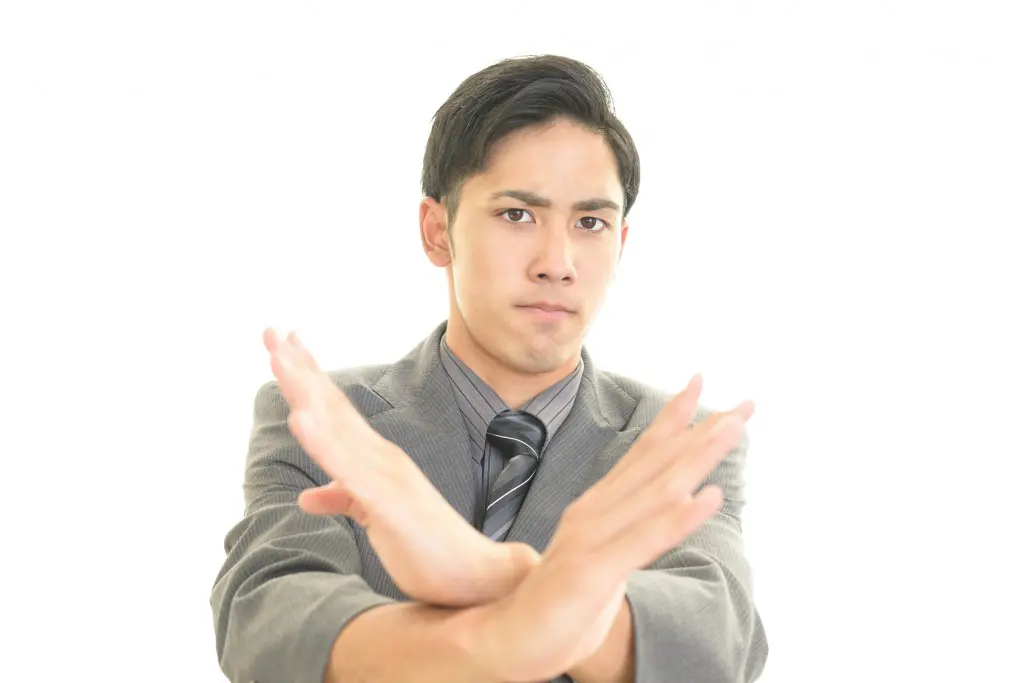 A man making a cross in front of his chest