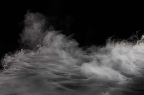 Image of smoke rising from a black background