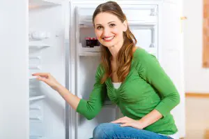 Woman opening the refrigerator